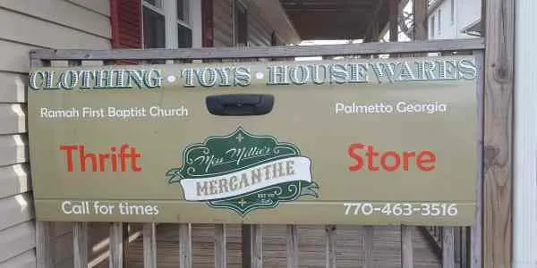 A sign advertising Miss Millie's Mercantile Thrift Store